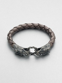 EXCLUSIVELY AT SAKS. A braided strand of luxuriously, smooth leather is offset by a sculpted sterling silver clasp.LeatherSterling silverAbout 3 diam.Imported EXCLUSIVELY AT SAKS. A braided strand of luxuriously, smooth leather is offset by a sculpted sterling silver clasp.LeatherSterling silverAbout 3 diam.Imported