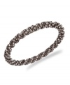 Add a little illumination. Sparkling glass stones and a chic, twisted design create an impressive design on Alfani's pretty bracelet. Set in bronze tone mixed metal. Approximate diameter: 2-3/4 inches.