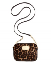 London, Paris, Copacabana, or just car-pooling, this leopard print lovely from MICHAEL Michael Kors is the perfect companion. Soft haircalf is accented with golden hardware and chain-link detailing, while the compact interior easily stows passports and pacifiers. London, Paris, Copacabana, or just car-pooling, this leopard print lovely from MICHAEL Michael Kors is the perfect companion. Soft haircalf is accented with golden hardware and chain-link detailing, while the compact interior easily stows passports and pacifiers.