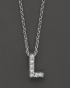 From the Tiny Treasures collection, a diamond L necklace. With signature ruby accent. Designed by Roberto Coin.