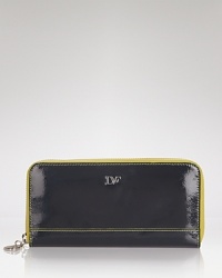 Embrace DIANE von FURSTENBERG style in an everyday sort of way with this patent leather wallet, which works stylish functionality with its 12 credit card slots and shapely zip close design. Embrace DIANE von FURSTENBERG style in an everyday sort of way with this patent leather wallet, which works stylish functionality with its 12 credit card slots and shapely zip close design.