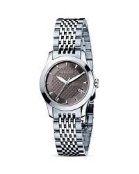 A stainless steel watch from the Gucci G-Timeless collection. Round brown dial with pattern and stick hour indices. Sweep second hand and date window. A stainless steel watch from the Gucci G-Timeless collection. Round brown dial with pattern and stick hour indices. Sweep second hand and date window.
