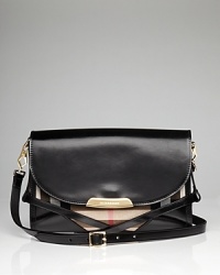 A glossy leather flap on this Burberry crossbody conceals the brand's signature checked motif, creating a cool contrast on this compact piece. A glossy leather flap on this Burberry crossbody conceals the brand's signature checked motif, creating a cool contrast on this compact piece.