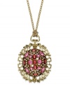 Unique, ornate and beautiful. This intricate pendant features pretty pink acrylic stones surrounded by detailed designs. Crafted in antiqued gold tone mixed metal. Approximate length: 30 inches + 2-inch extender. Approximate drop: 2-1/2 inches.