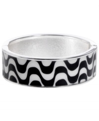 Channel the exoticism and energy of Brasil in Haskell's inspired skinny bangle. The Streets bangle features a black and white wavy print design, set in silver tone mixed metal with a hinge clasp. Approximate diameter: 2-1/2 inches. Approximate length: 8 inches. Item comes packaged in a turquoise gift box.