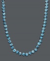 Cool down your look in icy blue hues. This vibrant necklace features a seamless row of round-cut blue topaz (45 ct. t.w.) set in sterling silver. Approximate length: 17 inches.