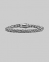 From the Kodiak Collection. A handsome, hand-woven herringbone braid of sterling silver with a bold carved clasp.6mm sterling silver braid Length, about 8½ Lobster clasp Made in USA