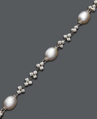 A traditional pearl bracelet with an intricate spin. Bracelet features cultured freshwater pearls (8-9 mm) strung on a sterling silver chain accented with clusters of sparkle beads. Approximate length: 7 inches. A traditional pearl bracelet with an intricate spin. Bracelet features cultured freshwater pearls (8-9 mm) strung on a sterling silver chain accented with clusters of sparkle beads. Approximate length: 7 inches.