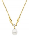 Make waves on the fashion front. Crafted from 10k gold, this necklace features a cultured freshwater pearl (7-9 mm) and a sparkling diamond accent for an elegant effect. Approximate length: 18 inches. Approximate drop: 1/2 inch.