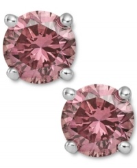 Perfection in pink. These sparkling stud earrings feature round-cut pink diamonds (1-1/2 ct. t.w.) in a four-prong setting of 14k white gold. Approximate diameter: 1/4 inch. Perfection in pink. These sparkling stud earrings feature round-cut pink diamonds (1-1/2 ct. t.w.) in a four-prong setting of 14k white gold. Approximate diameter: 1/4 inch.