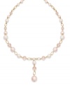 Sweet pink imitation pearls and a dangling strand make this Charter Club strand necklace a darling addition for your seasonal look. Crafted in gold tone mixed metal. Approximate length: 16-1/2 inches + 1-1/2-inch extender. Approximate drop: 1-1/2 inches.