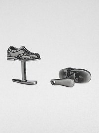 If the shoe fits, wear it on your sleeve with these sterling silver and black rhodium cuff links.Sterling silverShoe horn-shaped backAbout .87 diam.Made in USA If the shoe fits, wear it on your sleeve with these sterling silver and black rhodium cuff links.Sterling silverShoe horn-shaped backAbout .87 diam.Made in USA