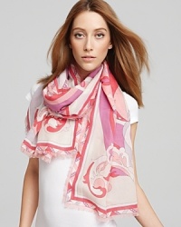 Floral shapes twist and turn down this elegant oblong scarf from Emilio Pucci. Floral shapes twist and turn down this elegant oblong scarf from Emilio Pucci.