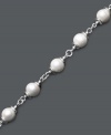 Exquisite elegance crafted in simple pearl and silver. A delicate strand of cultured freshwater pearls (9-10 mm) is complemented perfectly by its sterling silver setting. Approximate length: 8 inches.