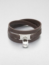 This effortless style features a chic logo accented padlock charm on a supple wrapped leather strip. LeatherSilvertone brassLength, about 25Buckle closureImported This effortless style features a chic logo accented padlock charm on a supple wrapped leather strip. LeatherSilvertone brassLength, about 25Buckle closureImported
