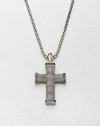 Black diamonds outline this exquisite cross pendant of sterling silver, suspended from a box chain necklace.Sterling silverBlack diamondLength, about 22Imported