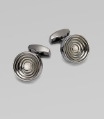 Concentric links of gunmetal-plated metal are polished on the outside and sandblasted in the recessed ridges to enhance the pattern. Gunmetal-plated metal About ½ diam. Made in the United Kingdom 