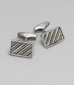 Rectangular sterling silver links are set with hand-twisted wire inlaid within silver bars. Sterling silver About ¼ X ½ Made in the United Kingdom 