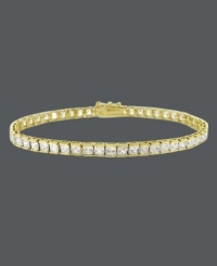 Add an element of luxury to your look with a luminous bracelet. B. Brilliant design features a row of round-cut, channel-set cubic zirconias (10 ct. t.w.) set in 18k gold over sterling silver. Approximate length: 7-1/4 inches. Add an element of luxury to your look with a luminous bracelet. B. Brilliant design features a row of round-cut, channel-set cubic zirconias (10 ct. t.w.) set in 18k gold over sterling silver. Approximate length: 7-1/4 inches.