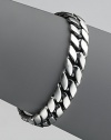 Narrow curb chain in sterling silver. 8½ long Imported