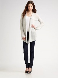 Ultra-soft cashmere shapes the body with and angular hem and bell sleeves. Dry clean or hand wash Imported