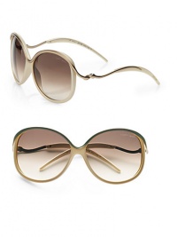 Feminine style with metal accented temples, top rim and bridge on a lightweight, acetate frame. Available in light gold ruthenium with brown gradient lens. Logo etched lens100% UV protectionMade in Italy Feminine style with metal accented temples, top rim and bridge on a lightweight, acetate frame. Available in light gold ruthenium with brown gradient lens. Logo etched lens100% UV protectionMade in Italy