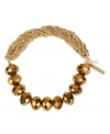 Fashion ripe for the picking! Kenneth Cole New York's half-stretch bracelet incorporates bronze tone cherry beads and gold tone chains. Bracelet stretches to fit wrist. Approximate length: 7-1/2 inches.