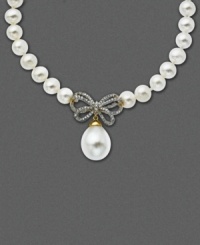 A sweet twist on an Audrey Hepburn classic. This 14k gold necklace of cultured freshwater pearls (10 mm) now incorporates a diamond-encrusted bow (1/4 ct. t.w.) and single hanging pearl pendant (12 mm). Approximate length: 17 inches. Approximate drop: 1 inch. A sweet twist on an Audrey Hepburn classic. This 14k gold necklace of cultured freshwater pearls (10 mm) now incorporates a diamond-encrusted bow (1/4 ct. t.w.) and single hanging pearl pendant (12 mm). Approximate length: 17 inches. Approximate drop: 1 inch.