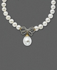 A sweet twist on an Audrey Hepburn classic. This 14k gold necklace of cultured freshwater pearls (10 mm) now incorporates a diamond-encrusted bow (1/4 ct. t.w.) and single hanging pearl pendant (12 mm). Approximate length: 17 inches. Approximate drop: 1 inch.