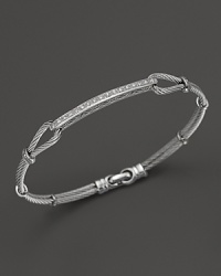 From the Classique Collection, a stackable bangle in 18K white gold and stainless steel cable with diamond station. Designed by Charriol. From the Classique Collection, a stackable bangle in 18K white gold and stainless steel cable with diamond station. Designed by Charriol.