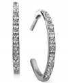 Treat yourself to a pair of versatile hoop earrings that can be worn day or night. Hoop earrings feature channel-set, round-cut diamonds (1/10 ct. t.w.) in a sterling silver setting. Approximate diameter: 3/4 inch.