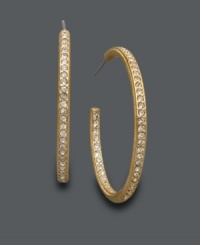 Sparkle from every angle. Eliot Danori's chic crystal hoops feature an in and out design. Crafted in gold tone mixed metal. Approximate diameter: 1 inch. Sparkle from every angle. Eliot Danori's chic crystal hoops feature an in and out design. Crafted in gold tone mixed metal. Approximate diameter: 1 inch.