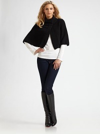 A luxurious cashmere design with a stand collar and snap closure. Stand collarElbow lengthFront snap closureAbout 15 from shoulder to hemCashmereDry cleanImported A luxurious cashmere design with a stand collar and snap closure. Stand collarElbow lengthFront snap closureAbout 15 from shoulder to hemCashmereDry cleanImported