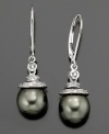 Daring style with a deep intrigue. These earrings feature Tahitian pearl (7-9mm) set in 14k gold and sterling silver with diamond accents. Approximate drop: 1-1/4 inches.