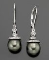 Daring style with a deep intrigue. These earrings feature Tahitian pearl (7-9mm) set in 14k gold and sterling silver with diamond accents. Approximate drop: 1-1/4 inches.