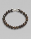 EXCLUSIVELY AT SAKS. From the Spiritual Bead Collection. Rustic bronzite beads are a bold contrast to the refinement of a sterling silver claw-design clasp.Beads, 8mm Length, about 8½ Spring clip clasp Imported