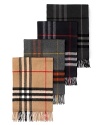Soft, woven cashmere muffler with fringe in iconic check pattern.