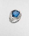 From the Infinity Collection. A richly colored, faceted blue topaz in a setting formed of intertwining smooth bands and cables of sterling silver.Blue topazSterling silverDiameter, about ½Imported