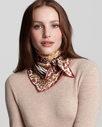 A collage of various animal prints embellish this luxurious silk scarf from Salvatore Ferragamo. A collage of various animal prints embellish this luxurious silk scarf from Salvatore Ferragamo.