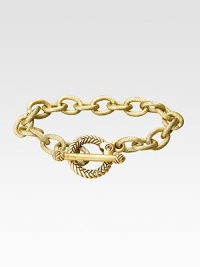 Bold, textured links in a gleaming gold finish have an ornate toggle closure. 18k goldplated Length, about 7½ Toggle closure with CRYSTALLIZED - Swarovski Elements accents Made in USA Bold, textured links in a gleaming gold finish have an ornate toggle closure. 18k goldplated Length, about 7½ Toggle closure with CRYSTALLIZED - Swarovski Elements accents Made in USA