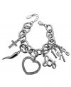 Show your love for GUESS! This charmer of a bracelet from GUESS features a cut-out heart charm and cross charm embellished with crystal accents. Finished with solid logo charms. Set in imitation rhodium silver tone mixed metal with a lobster claw clasp. Approximate length: 7-1/2 inches. Approximate drop: 1 inch.