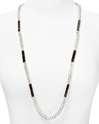 Glamor defined: A single strand of of silver-plated links mingle with tortoise shell for classically styled confidence. Slip on this ever-chic style from Lauren Ralph Lauren. Glamor defined: A single strand of of silver-plated links mingle with tortoise shell for classically styled confidence. Slip on this ever-chic style from Lauren Ralph Lauren.