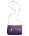 Pretty perforated perfection. This lovely leather crossbody goes glam with shiny goldtone hardware and a stunning chain detailed shoulder strap. Small logo detail featured at front.