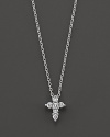From the Tiny Treasures collection, a diamond Cross necklace makes a religious statement; with signature ruby accent. Designed by Roberto Coin.