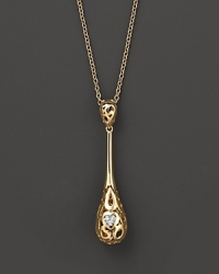 From the Mauresque collection, a teardrop lace-inspired pendant in 18 Kt. yellow gold with diamond pavé. With signature ruby accent. Designed by Roberto Coin. From the Mauresque collection, a teardrop lace-inspired pendant in 18 Kt. yellow gold with diamond pavé. With signature ruby accent. Designed by Roberto Coin.