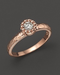 Faceted diamond set in a textured 14K. rose gold band. Faceted diamond set in a textured 14K. rose gold band.