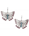 Frame your face with a little flutter. Fossil's free-spirited butterfly earrings combine purple and clear-colored crystal accents with reconstituted turquoise for color and shine. Set in silver tone mixed metal. Approximate drop: 1 inch.