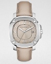 A classic timepiece with a brushed, grey stainless steel case and a luxurious leather strap. Quartz movementWater resistant to 5 ATMOctagonal stainless steel case, 38mm (1.5) Screw accented bezelNude dialBar and numeric hour markersDate display at 3 o'clockSecond hand Trench leather strapMade in Switzerland 