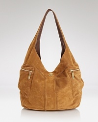 Impossibly effortless, this Tory Burch holdall refines city sleek accessorizing with its softly textured suede and spacious interior. Impossibly effortless, this Tory Burch holdall refines city sleek accessorizing with its softly textured suede and spacious interior.