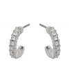 A hint of Swarovski sparkle adds just the right touch to your ensemble. 3/4 hoops feature sparkling clear crystals set in silver tone mixed metal. Approximate diameter: 1/2 inch.